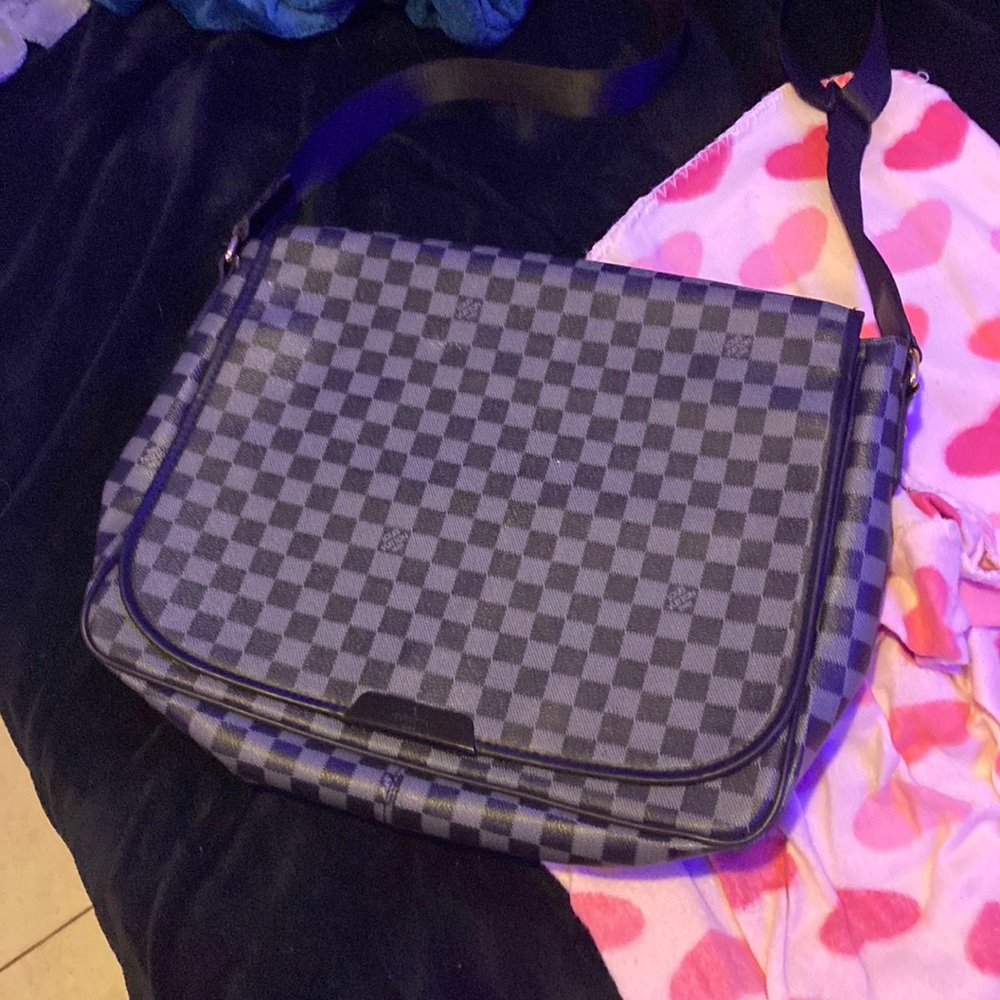 This is a Louis Vuitton computer bag my mom got me used it once.